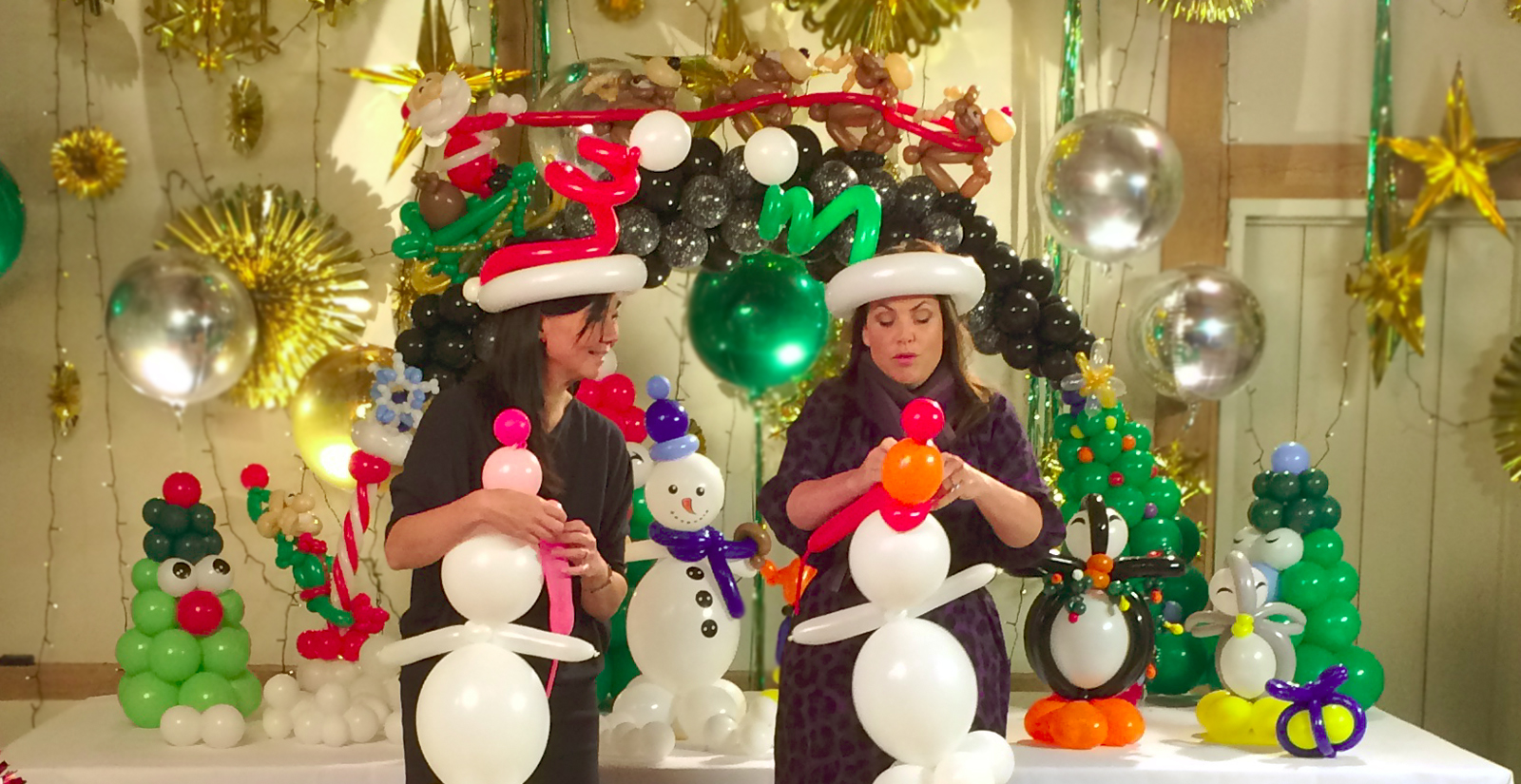 Lisa teaches Kirstie Allsop how to make a balloon snowman